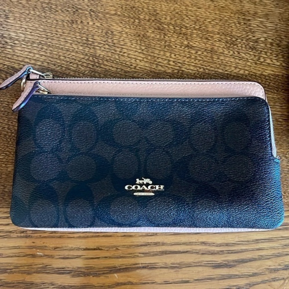 Coach dual pocket wallet monogrammed front with a pebbled, leather backside
